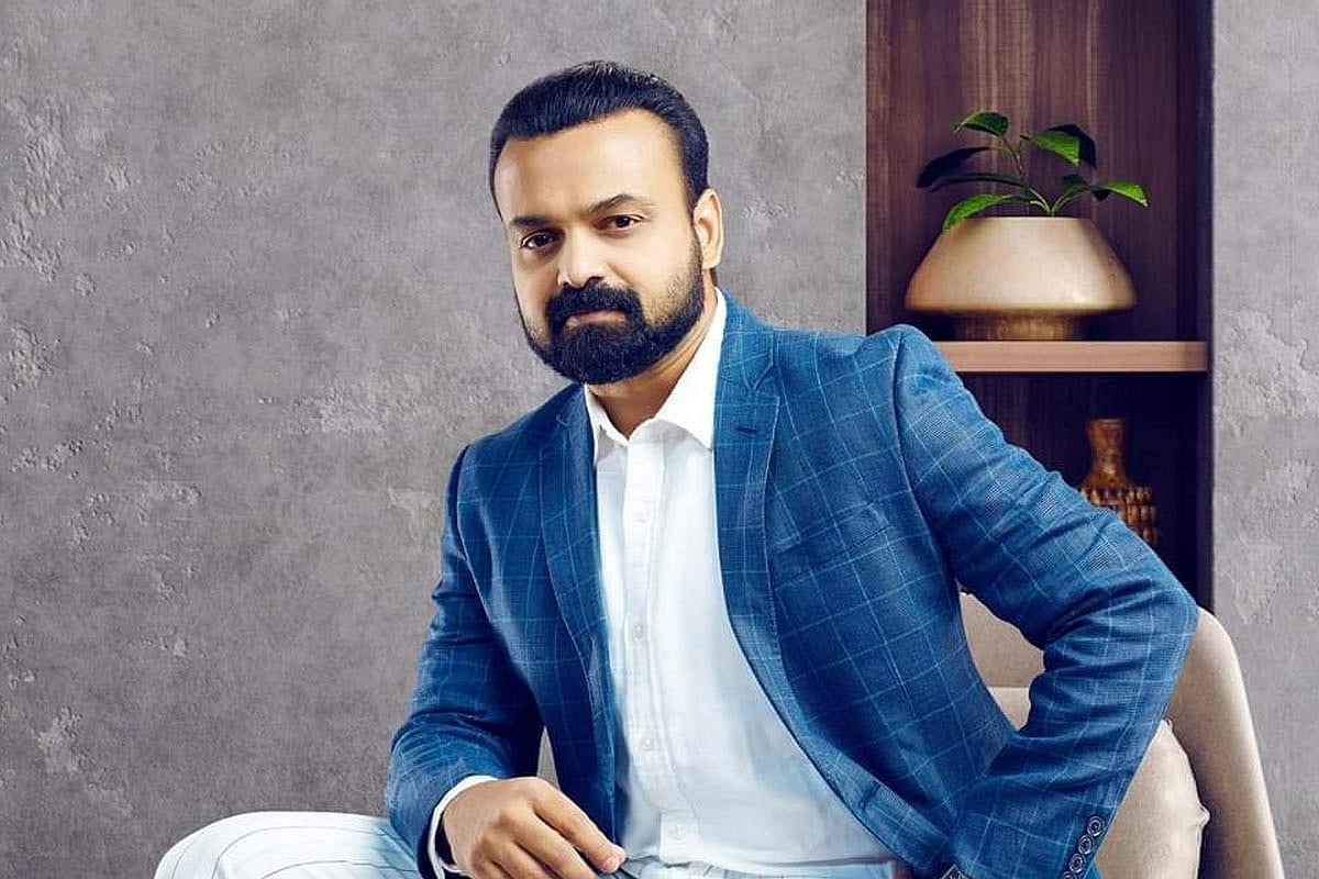Malayalam actor Kunchacko Boban wearing a blue checked suit
